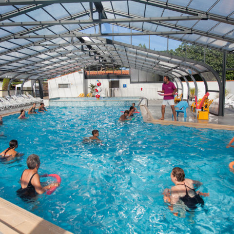 Aquagym classes in an indoor pool.