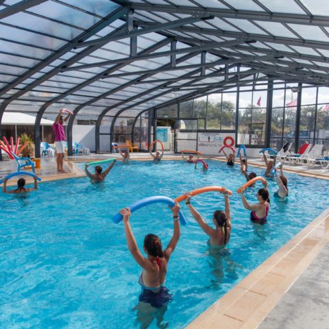 Aquagym classes in an indoor pool.